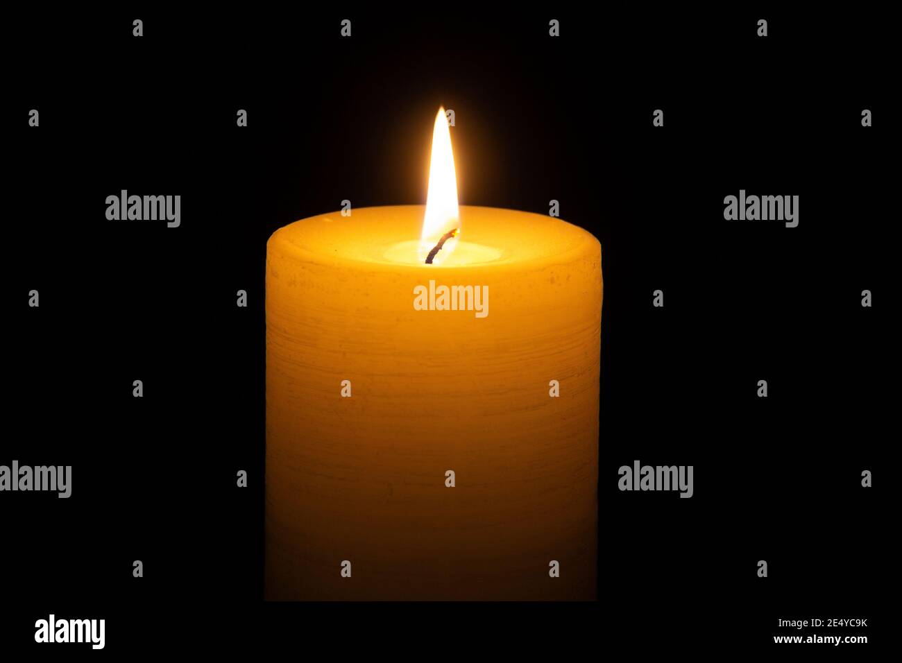 Glowing lit candle Stock Photo Alamy