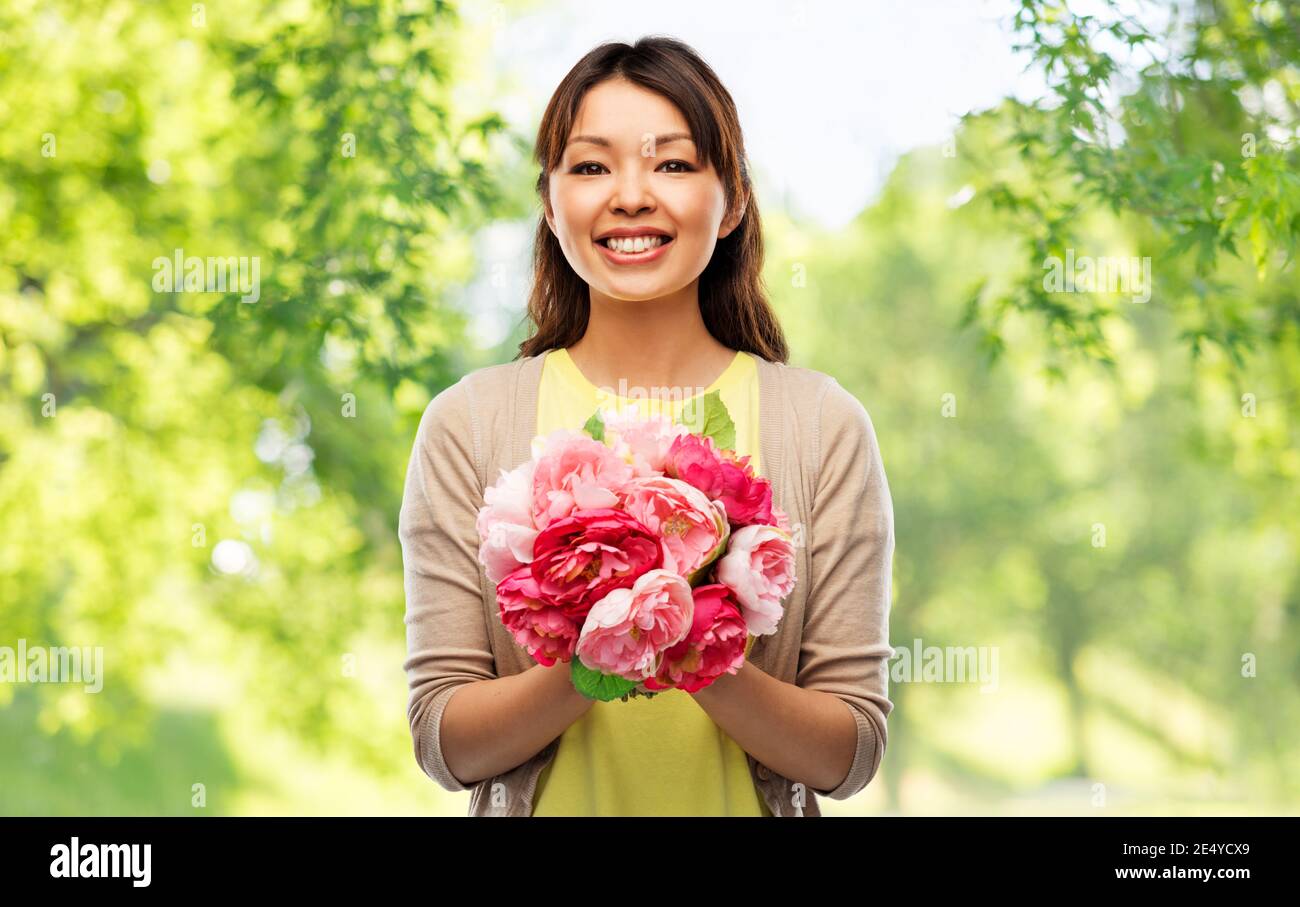 happy asian woman with bunch of flowers Stock Photo - Alamy