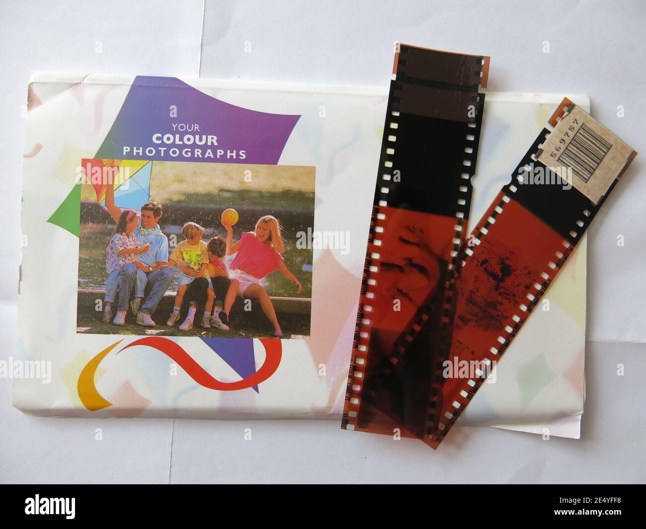 'Your colour photographs': a photo wallet produced by Smurfit Print UK with strips of negatives alongside. Stock Photo