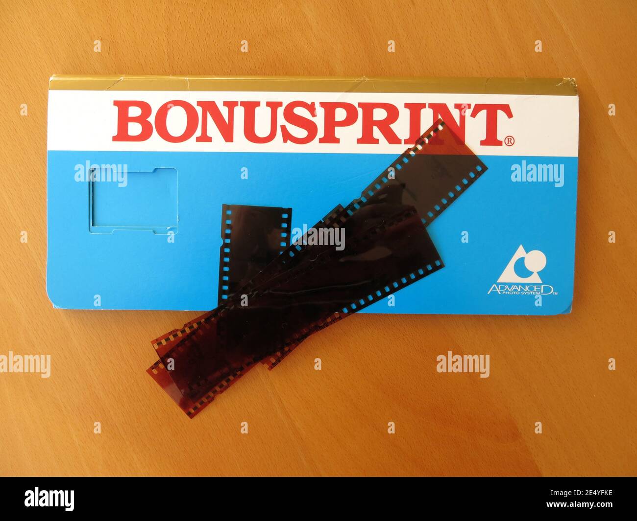 The typical blue wallet from Bonusprint to return customers' negatives and printed photos; extra long for the panoramic prints from an APS camera. Stock Photo