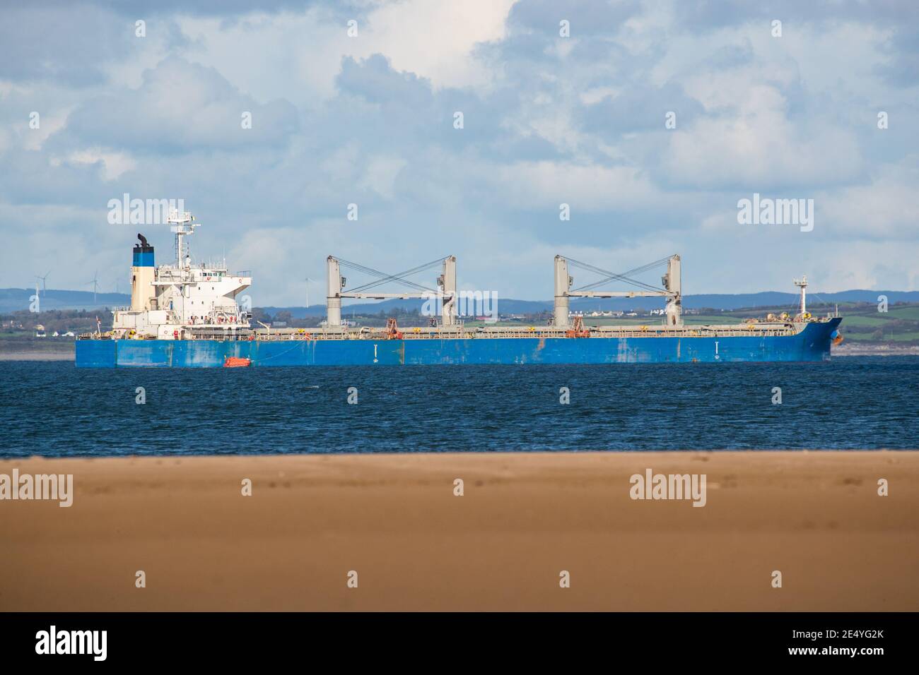 Large cargo ship tanker passing through the river Shannon in the Republic of Ireland Stock Photo