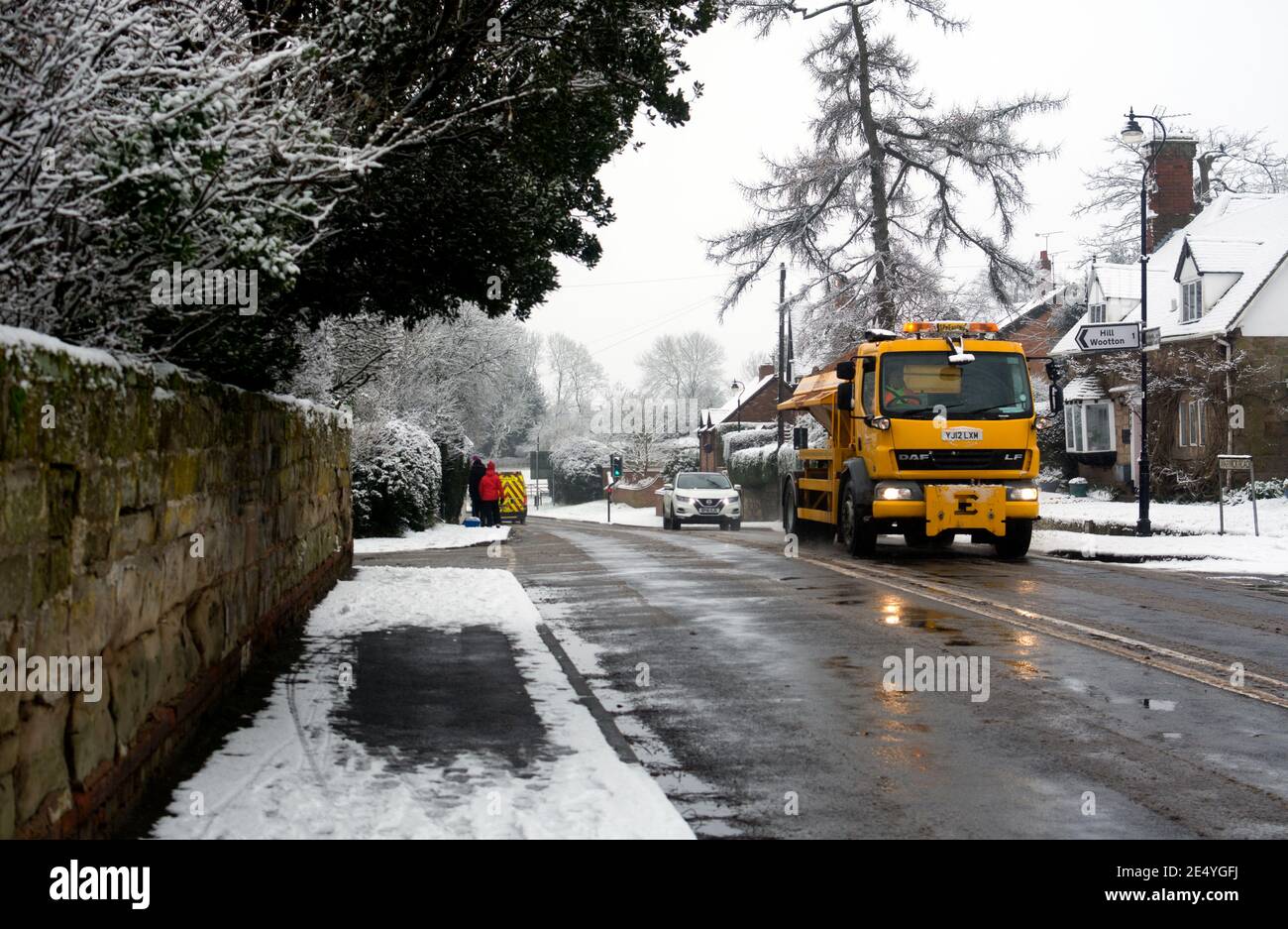 A road gritting lorry in snowy weather, Leek Wootton, Warwickshire, England, UK Stock Photo