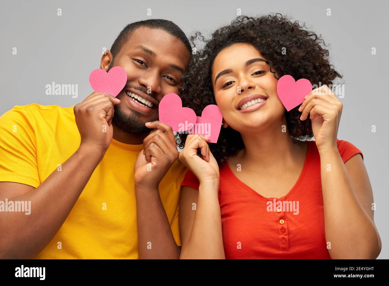 happy african american couple with hearts Stock Photo - Alamy