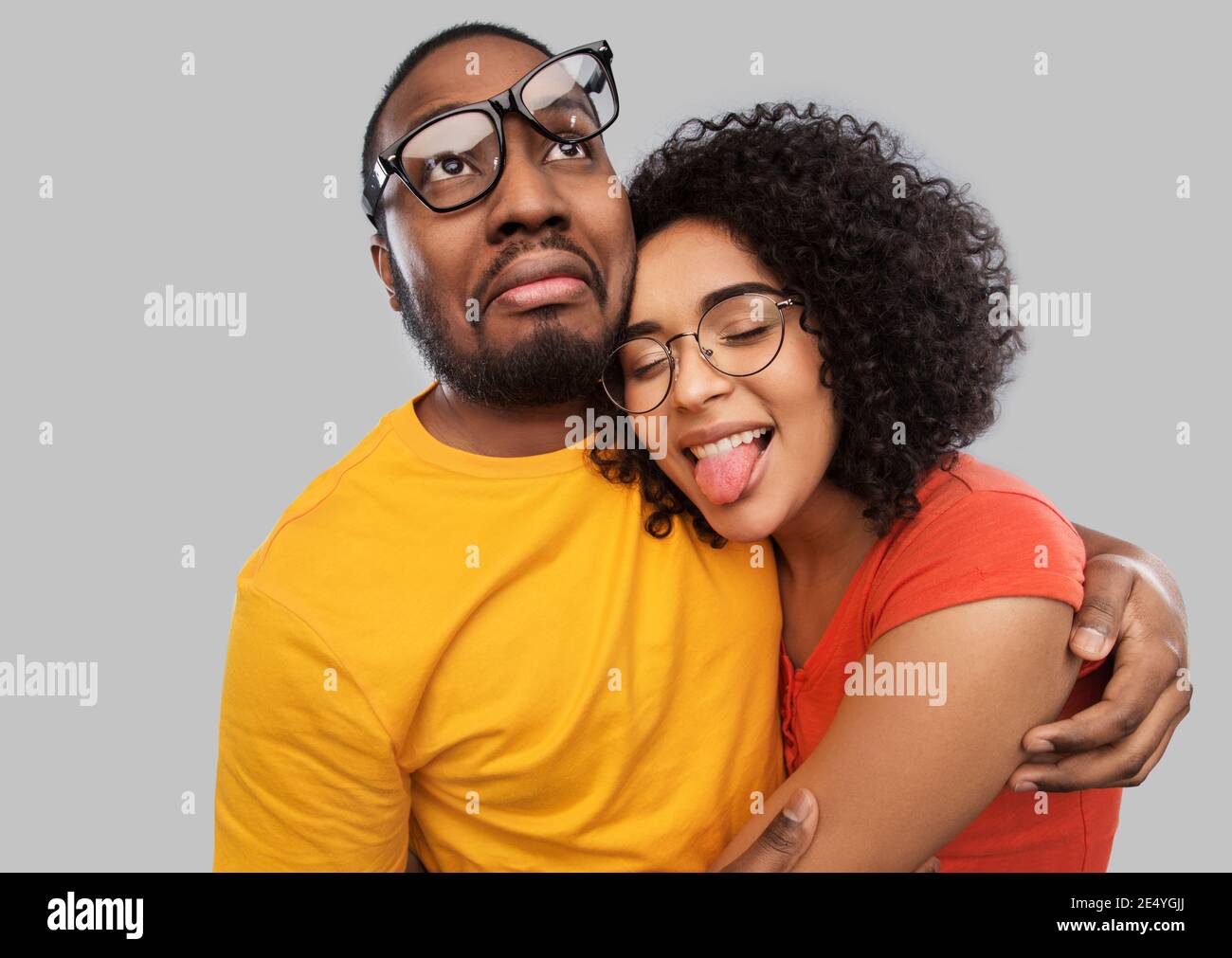 happy african american couple in glasses hugging Stock Photo - Alamy