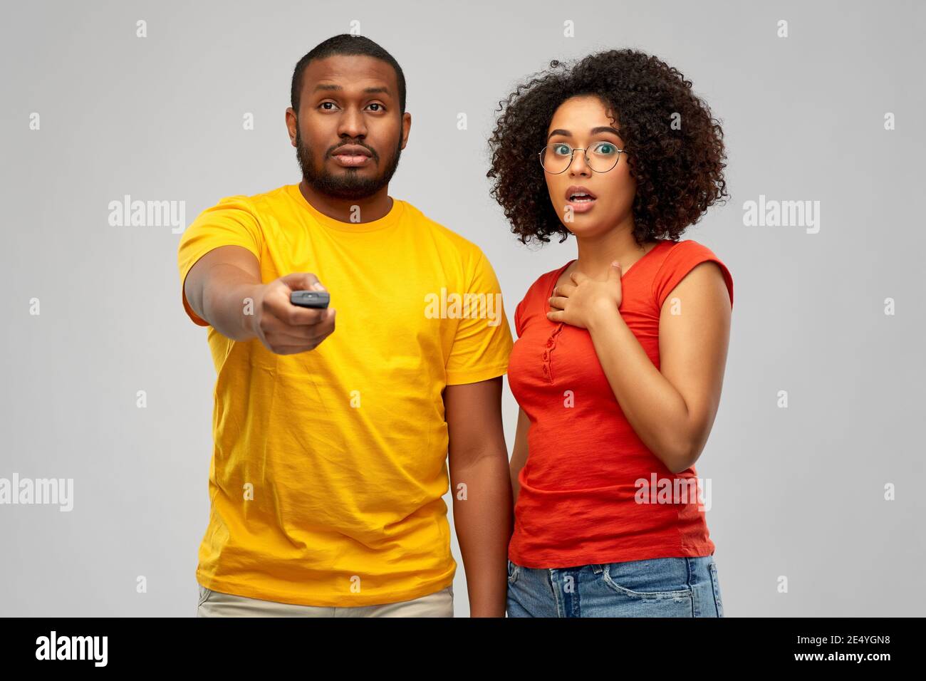 african american couple with tv remote control Stock Photo