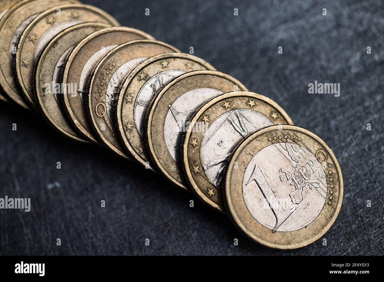 Pile of old and used one euro coins Stock Photo