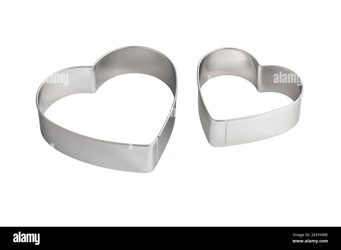 Two stainless steel heartshaped cookie cutters, isolated Stock Photo