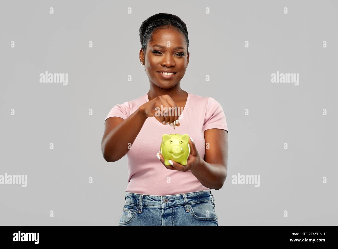 happy african american woman with piggy bank Stock Photo - Alamy