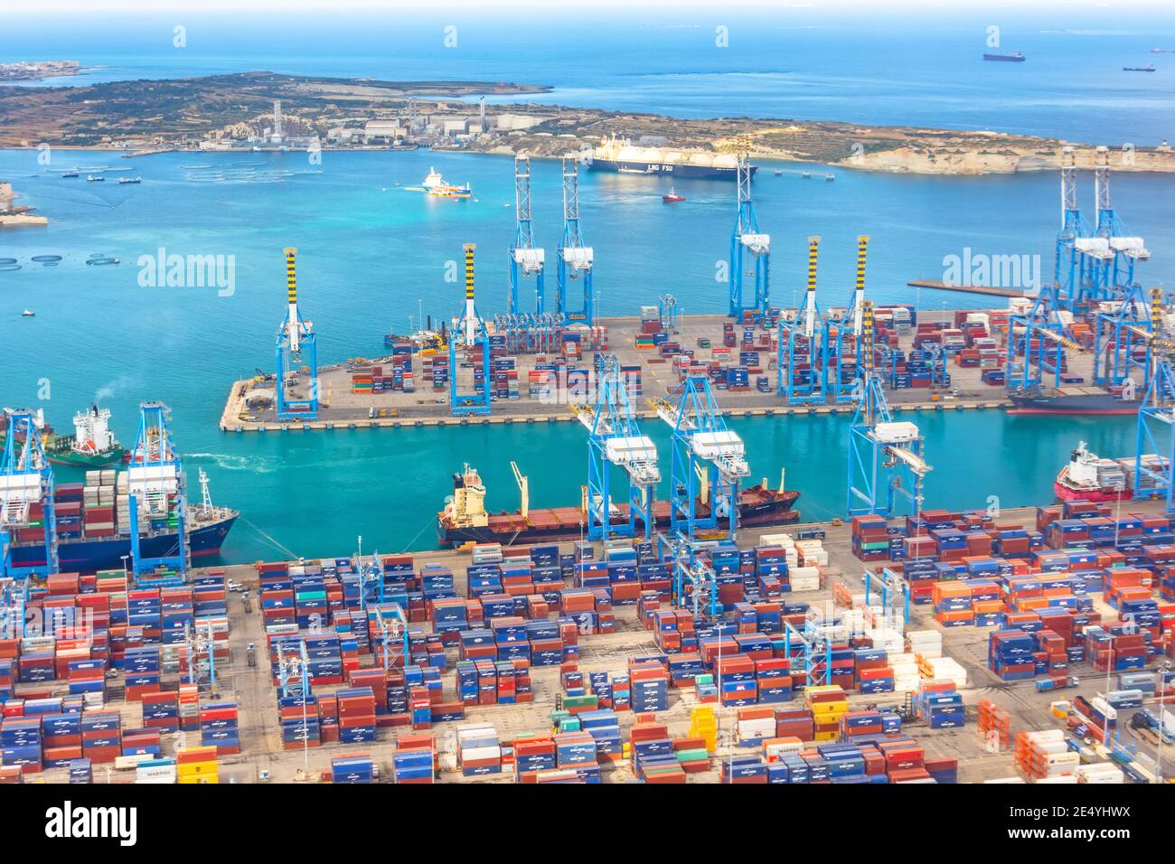 Huge ship moored to the port, cranes unload cargo. Great port, maritime