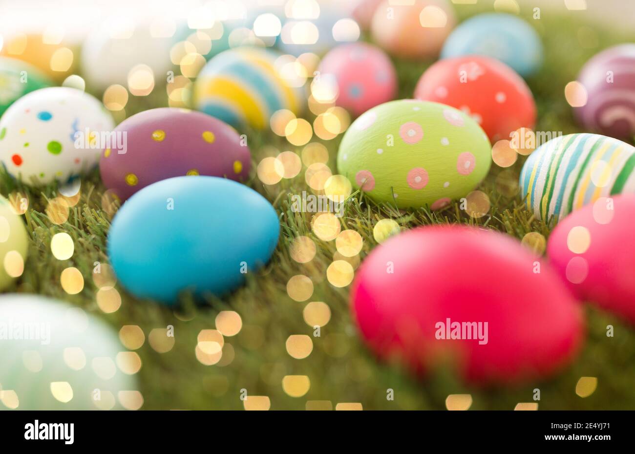 colored easter eggs on artificial grass Stock Photo
