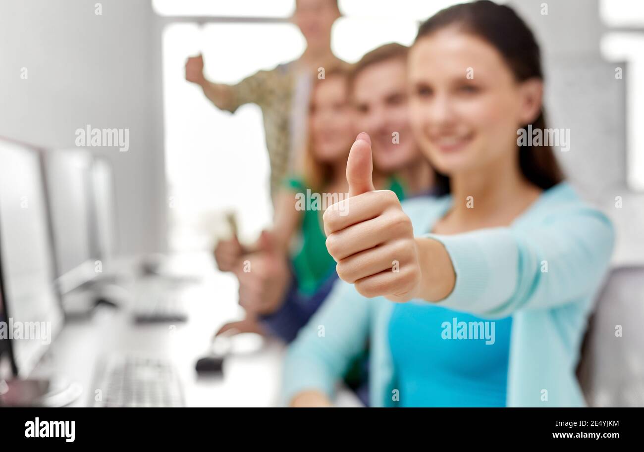 group of happy students showing thumbs up Stock Photo - Alamy