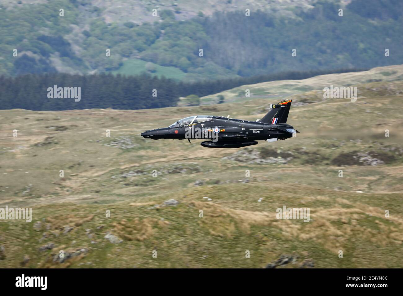 RAF Hawk T2 training aircraft on a low level flight in the mach loop area of Wales, UK. Stock Photo