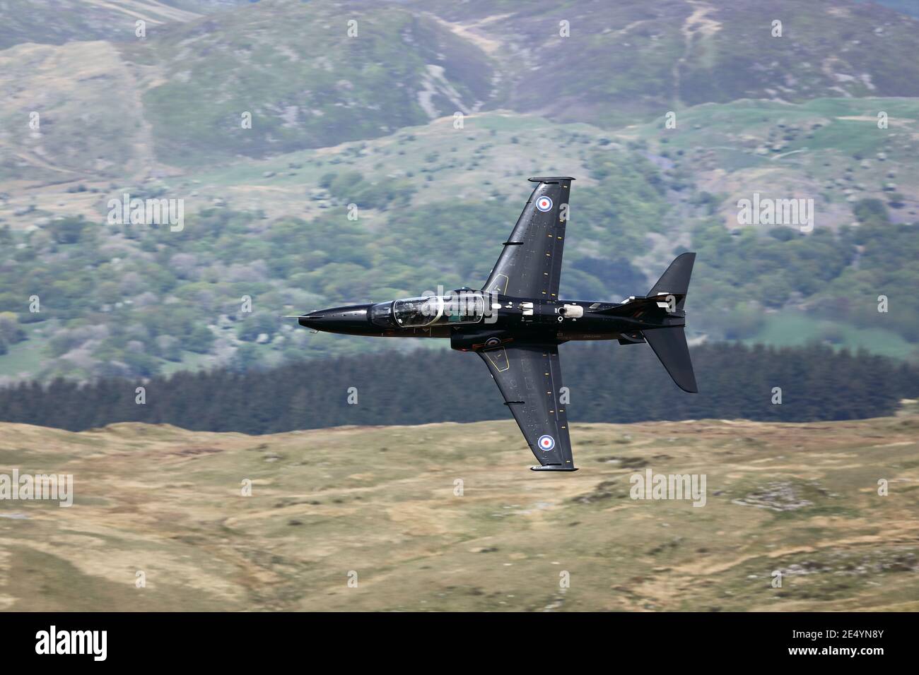 RAF Hawk T2 training aircraft on a low level flight in the mach loop area of Wales, UK. Stock Photo