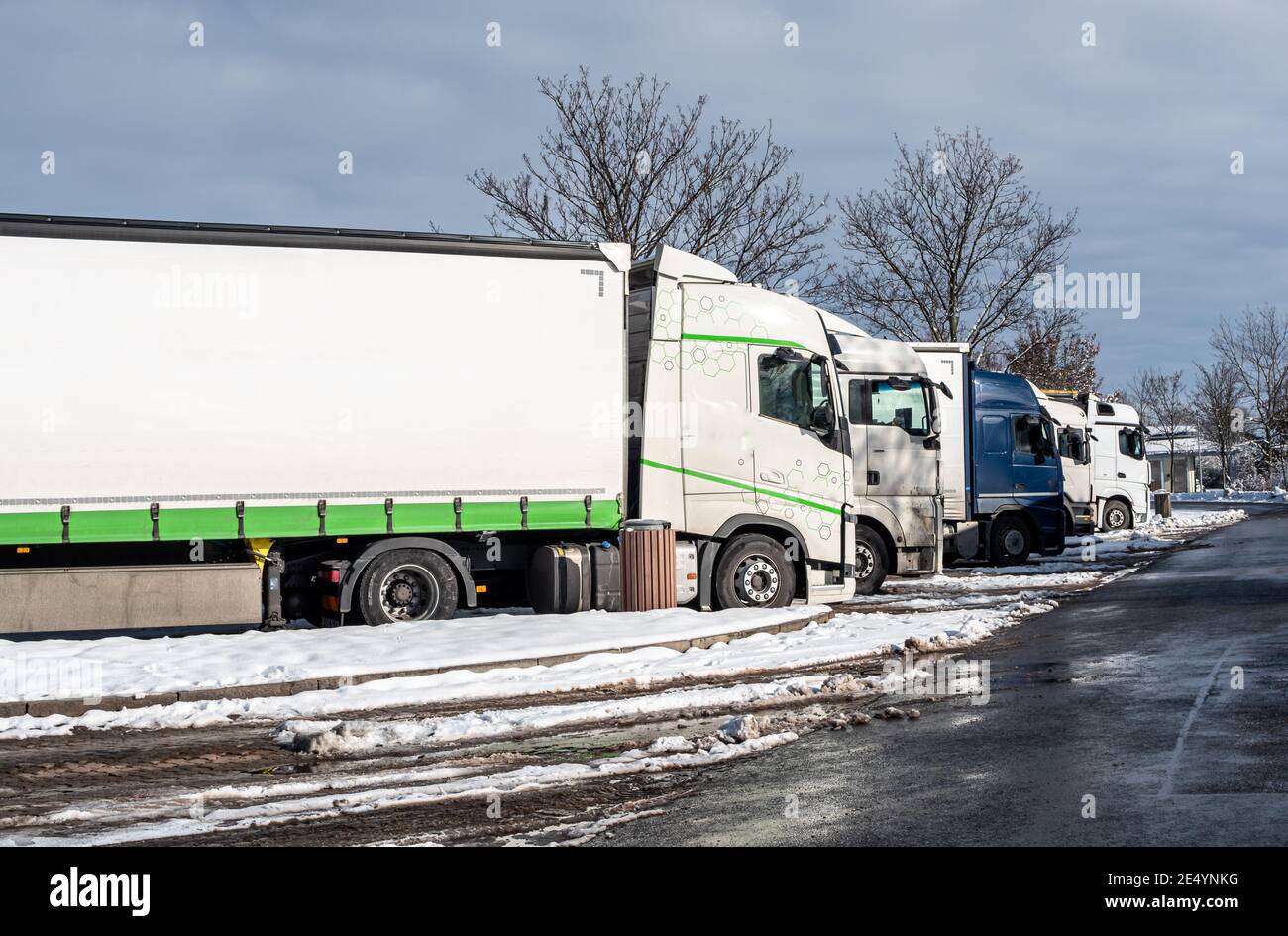 Trucks in winter at a rest area on the highway Stock Photo
