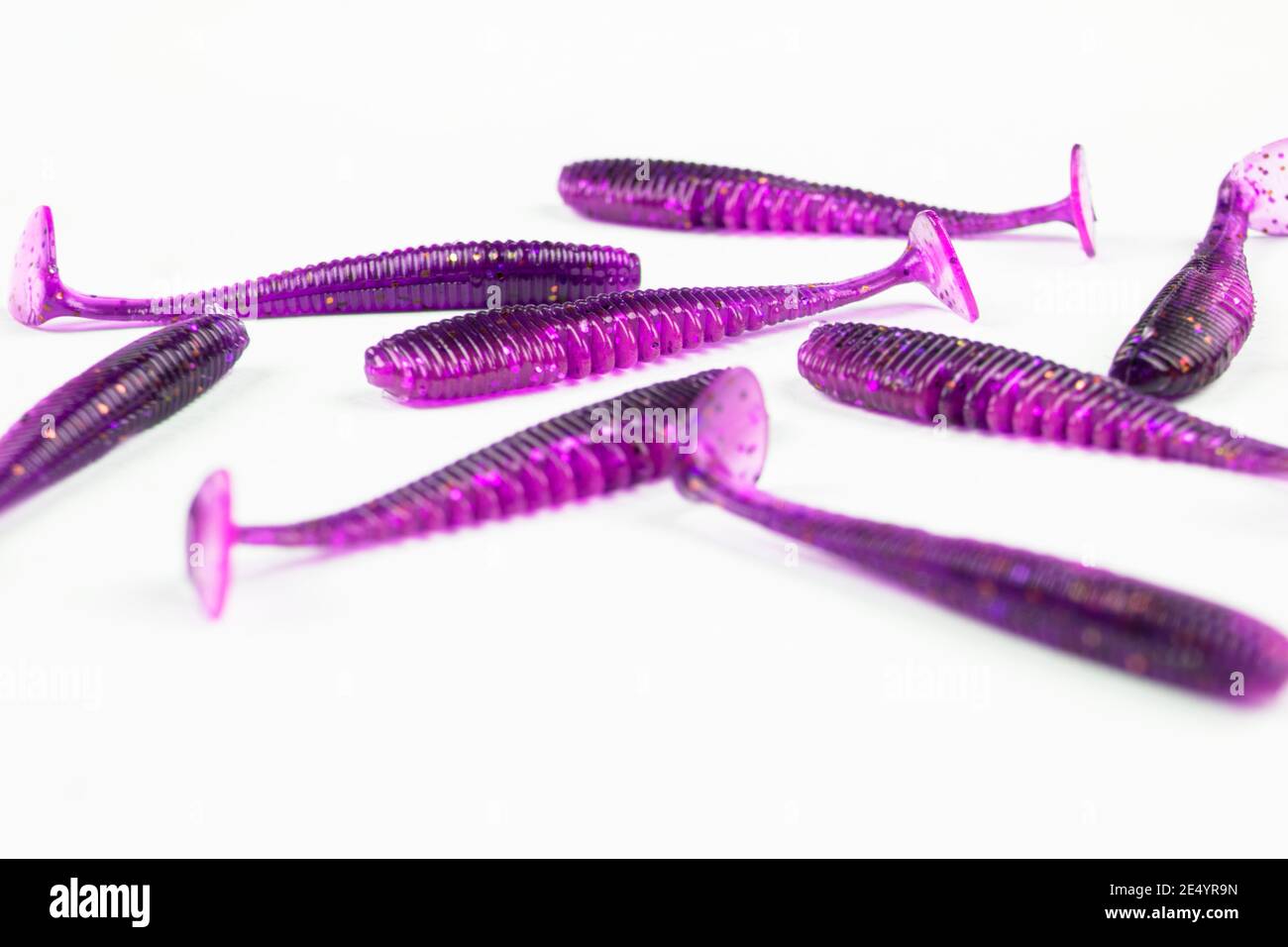 Jig silicone fishing lures isolated on a white background. Silicone fishing  baits isolated. Colorful baits. Fishing spinning bait. Silicone soft plast  Stock Photo - Alamy