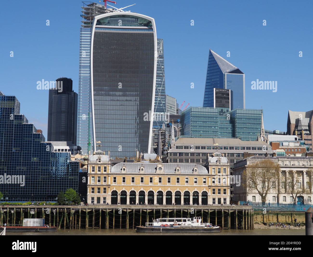view of historic and modern buildings on the north bank of the river Thames in London Stock Photo