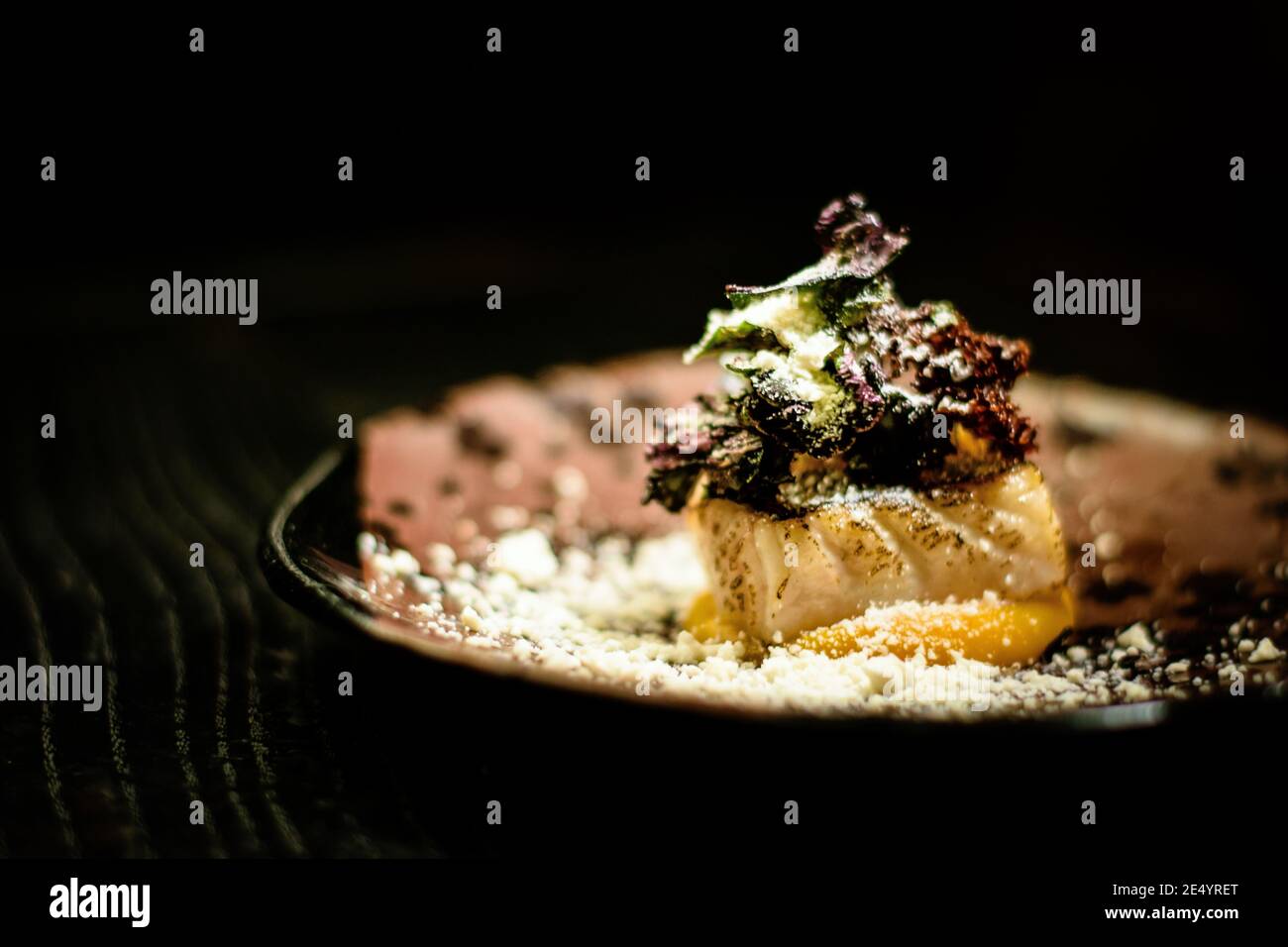 Dish of pike perch, pumpkin and horseradish at a restaurant Stock Photo
