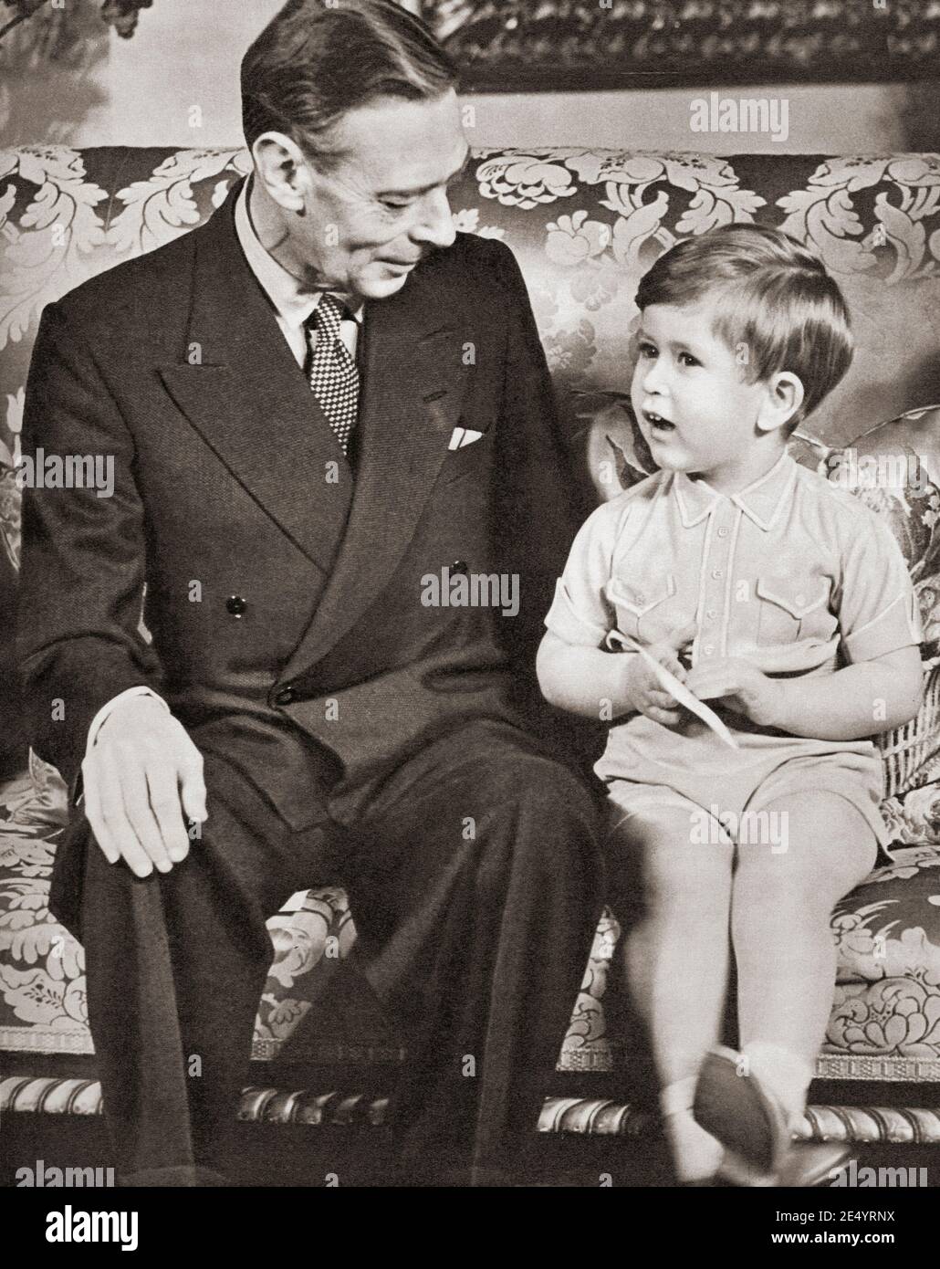 EDITORIAL ONLY George VI seen here with his grandson Prince Charles, on the Prince's third birthday, 1951.  George VI, Albert Frederick Arthur George, 1895 –1952. King of the United Kingdom and the Dominions of the British Commonwealth.  Charles, Prince of Wales (Charles Philip Arthur George) 1948.  Heir apparent to the British throne as the eldest son of Queen Elizabeth II.  From The Queen Elizabeth Coronation Book, published 1953. Stock Photo