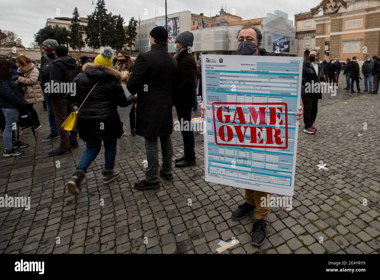 Rome, Italy. 25th Jan 2021. Rome, 25/01/2021. Today, a national demonstration in Piazza del Popolo to highlight the dramatic situation of the Hospitality Industry in Italy during the so called "second wave" of the pandemic Covid-19/Coronavirus, to call the Government to act for immediate investments, aids (Ristori), and policies to save their industry. Credit: LSF Photo/Alamy Live News Stock Photo