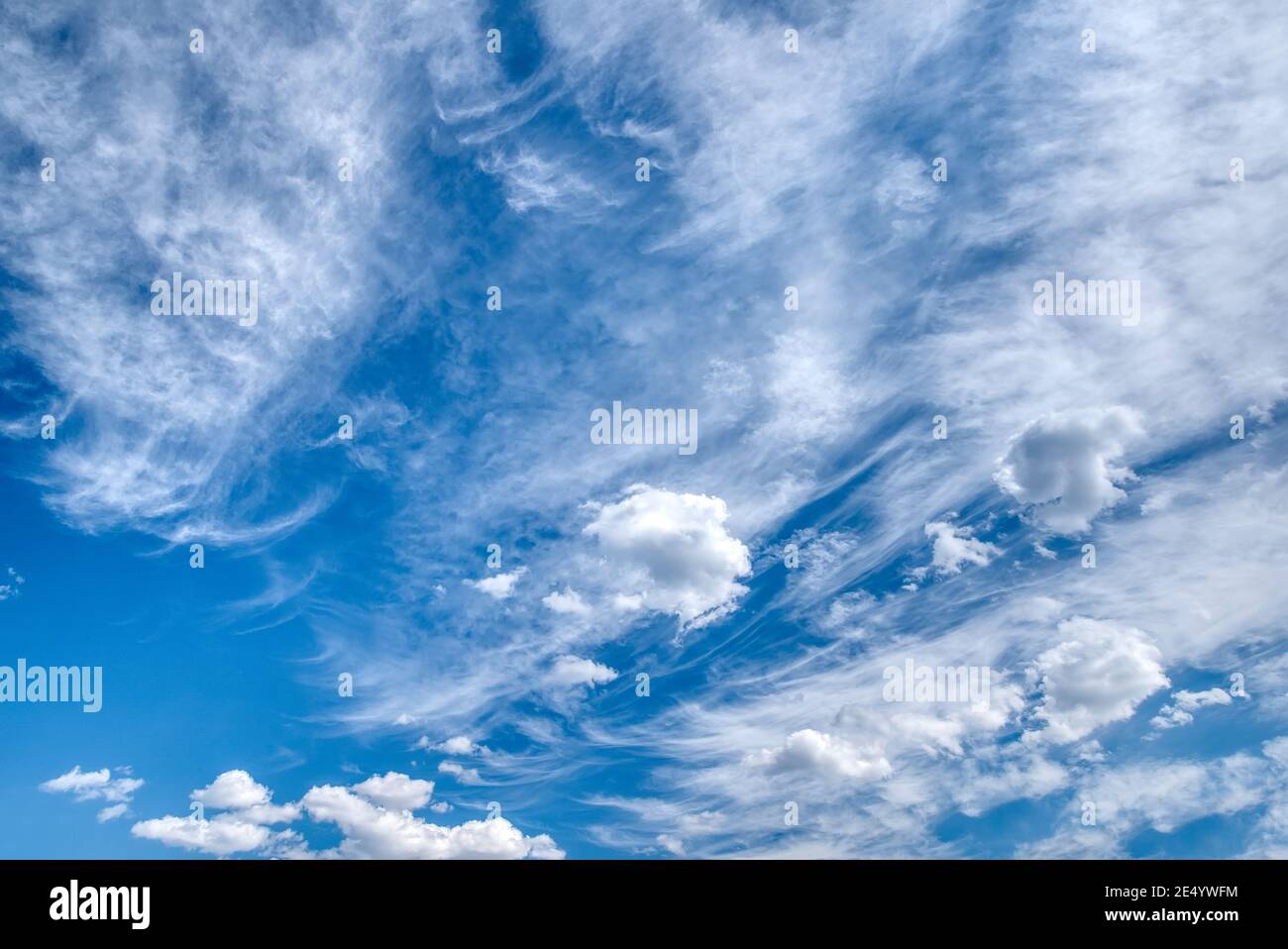 White fluffy clouds in the blue sky Stock Photo - Alamy
