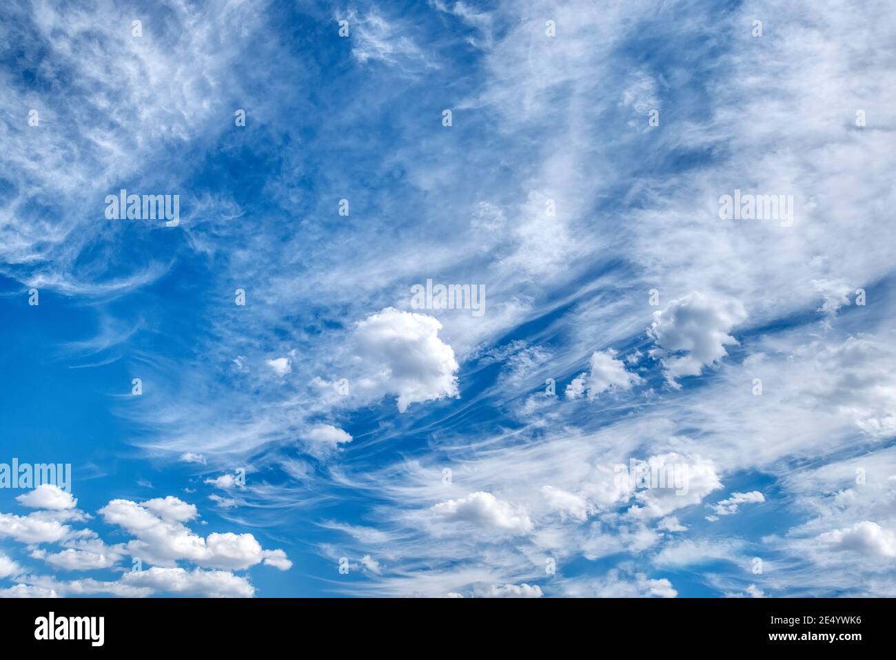 White fluffy clouds in the blue sky Stock Photo