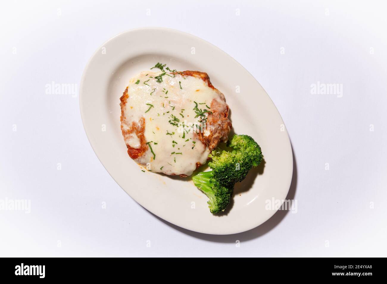 High Angle View of Veal Parmesan with Broccoli Stock Photo
