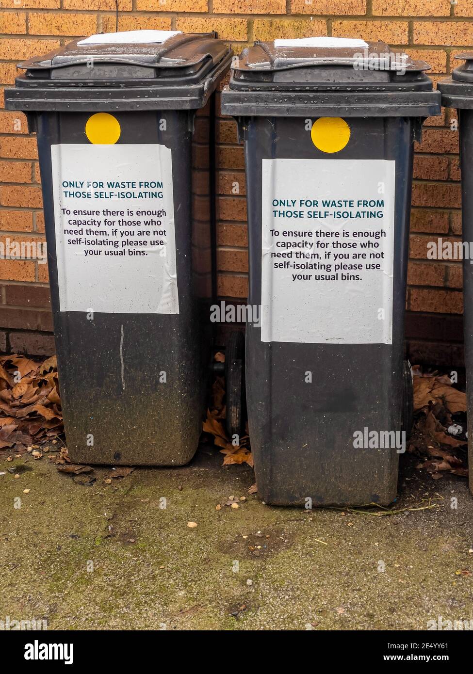 Wheely bins specifically for waste from people who are self isolating due to Covid-19 virus infection Stock Photo