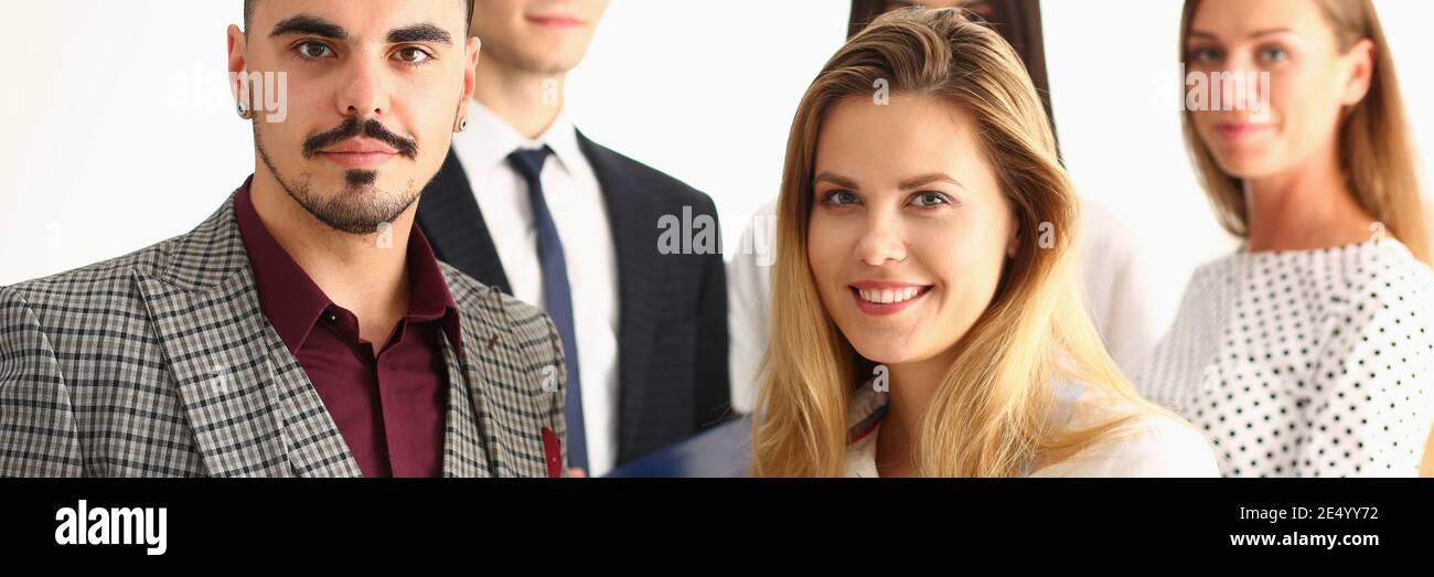 Successful happy workers are posing at camera Stock Photo