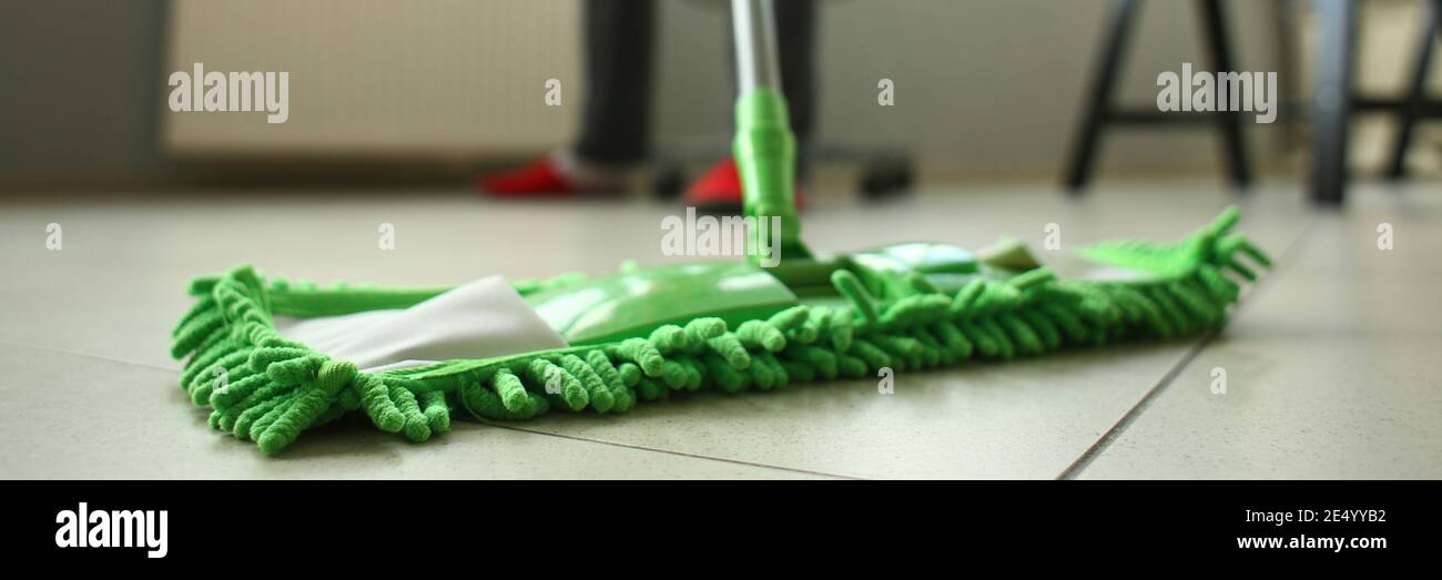 Cleaning service man mopping the floor in the room Stock Photo Alamy