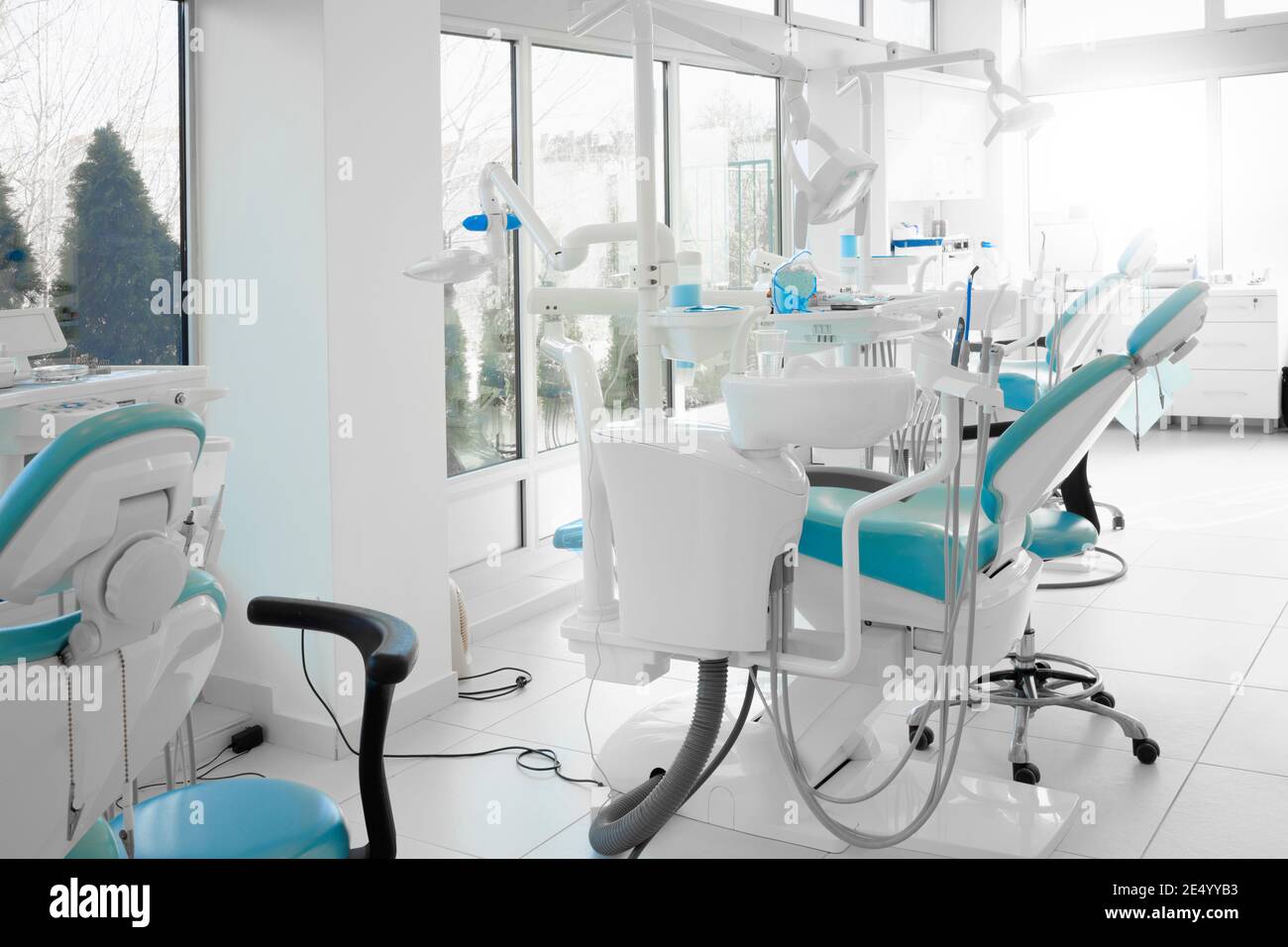 Interior of a modern dentist office with brand new dentist chairs Stock