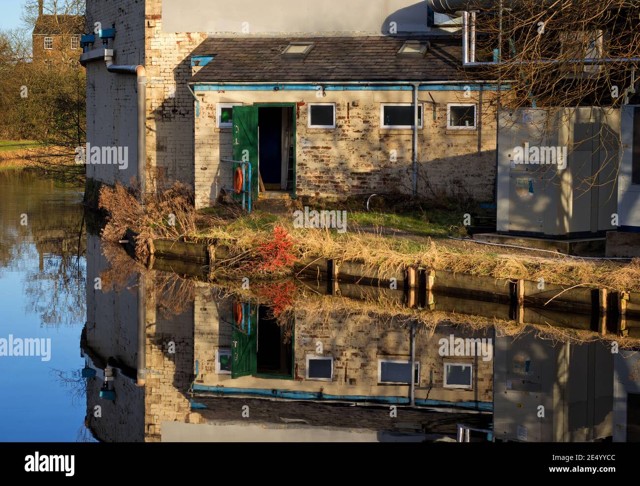 The engineer's hut, joined to the mill, along the Leeds and Liverpool canal, in Nelson, Lancashire, UK Stock Photo