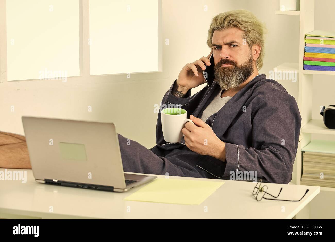 Sharing fresh ideas. relaxed businessman in home office. online agile business. man using laptop indoor. bearded man looking at his laptop screen. making business at home. e-commerce and shopping. Stock Photo