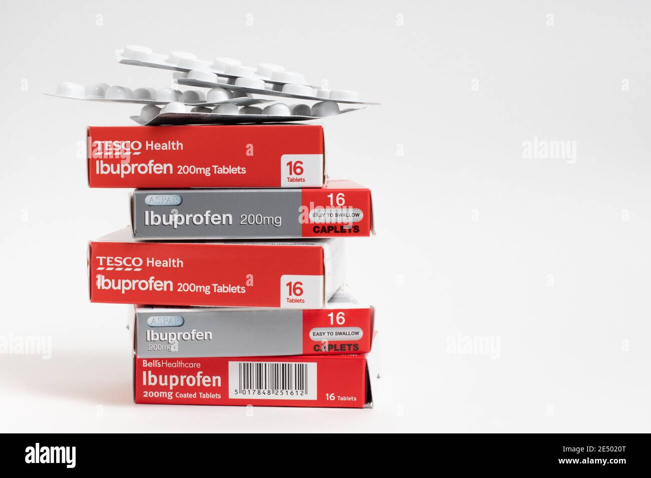 London / UK - January 23rd 2021 - Ibuprofen packets, piled up against a white background Stock Photo