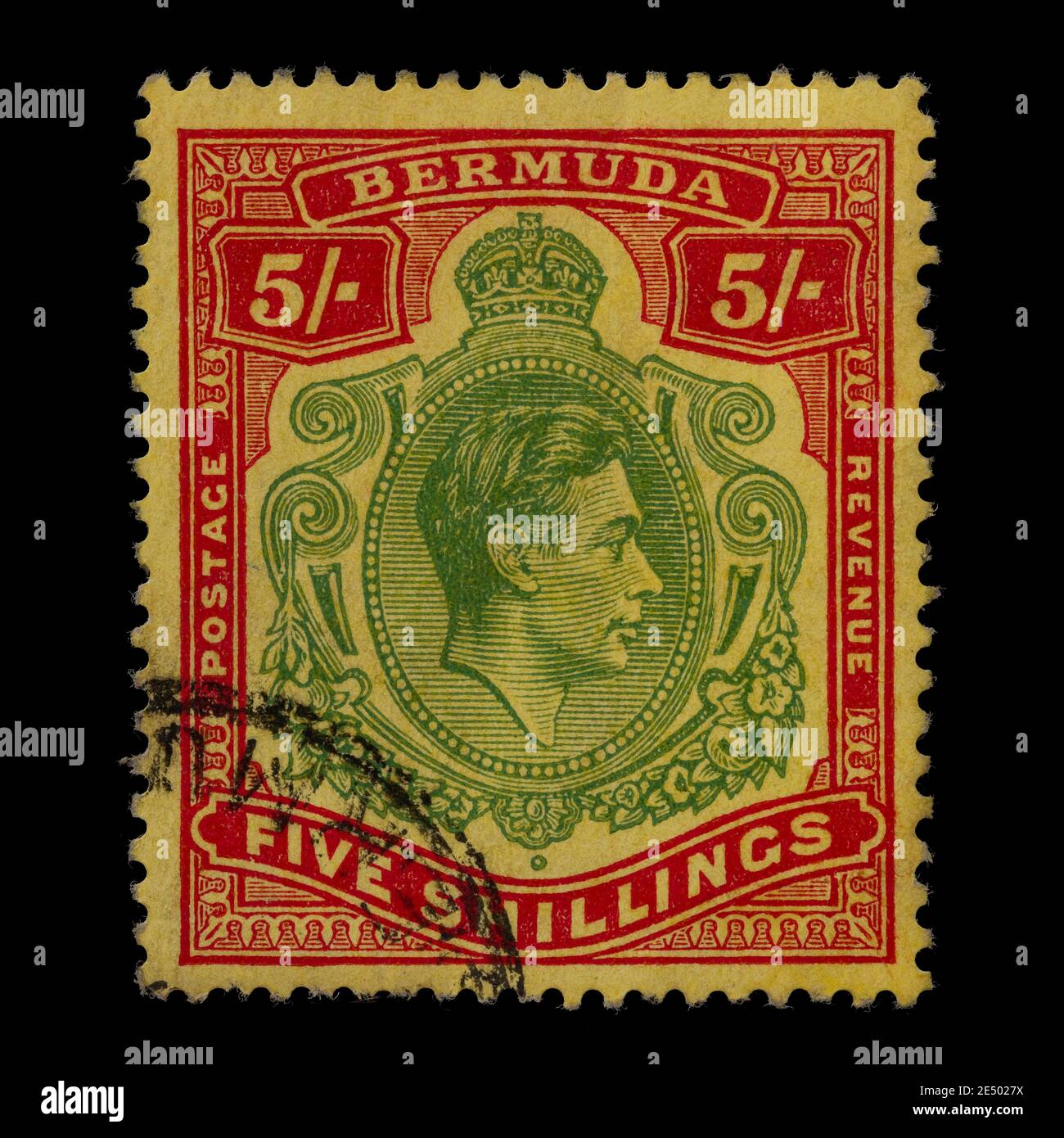 Vintage cancelled postage stamp from Bermuda. Face value of 5 shillings bearing the portrait of King George VI, Stock Photo