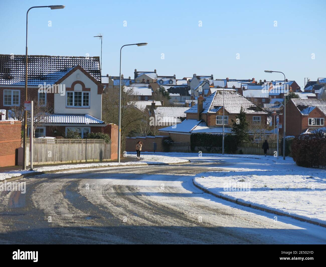 Snowy view of a road in Wootton Fields, a large, newlyexpanded