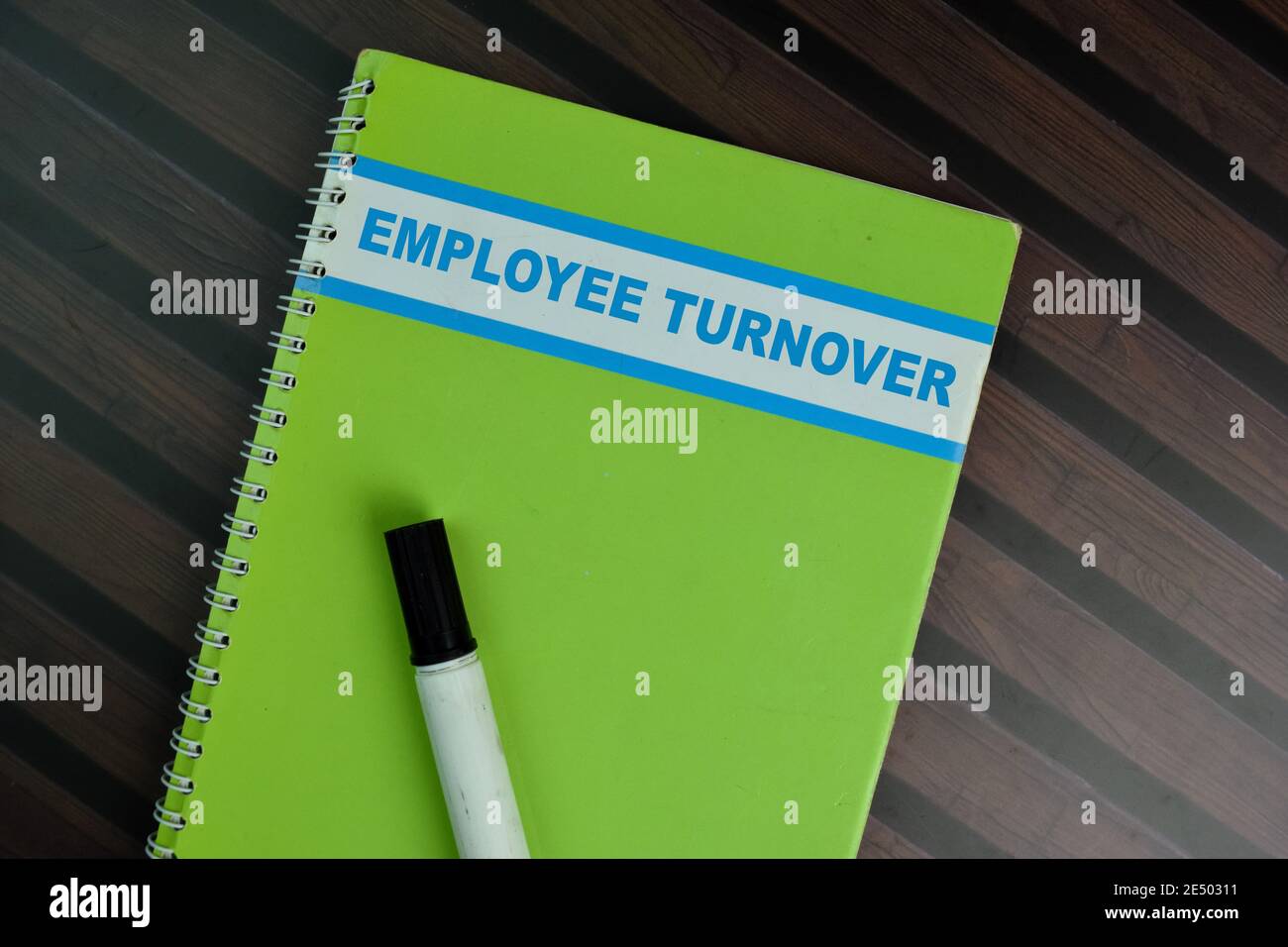 The book of Employee Turnover isolated on Wooden Table. Stock Photo