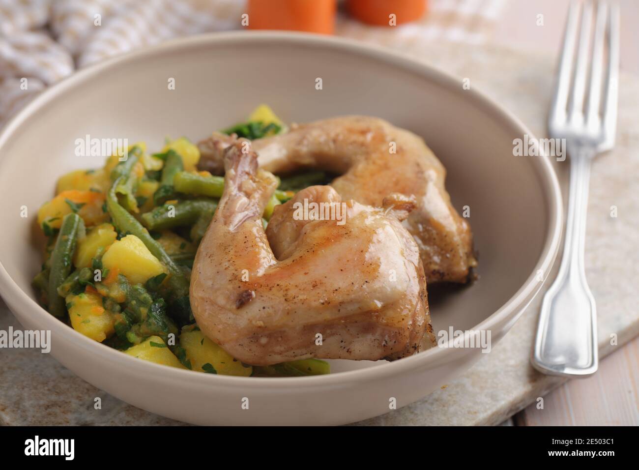 Chicken legs with potatoes and green beans Stock Photo