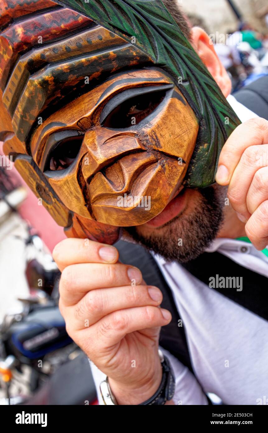 Wearing Mayan traditional mask - Colorful traditional symbols and accessories in local market in Antigua Guatemala - 22nd of April 2011 Stock Photo