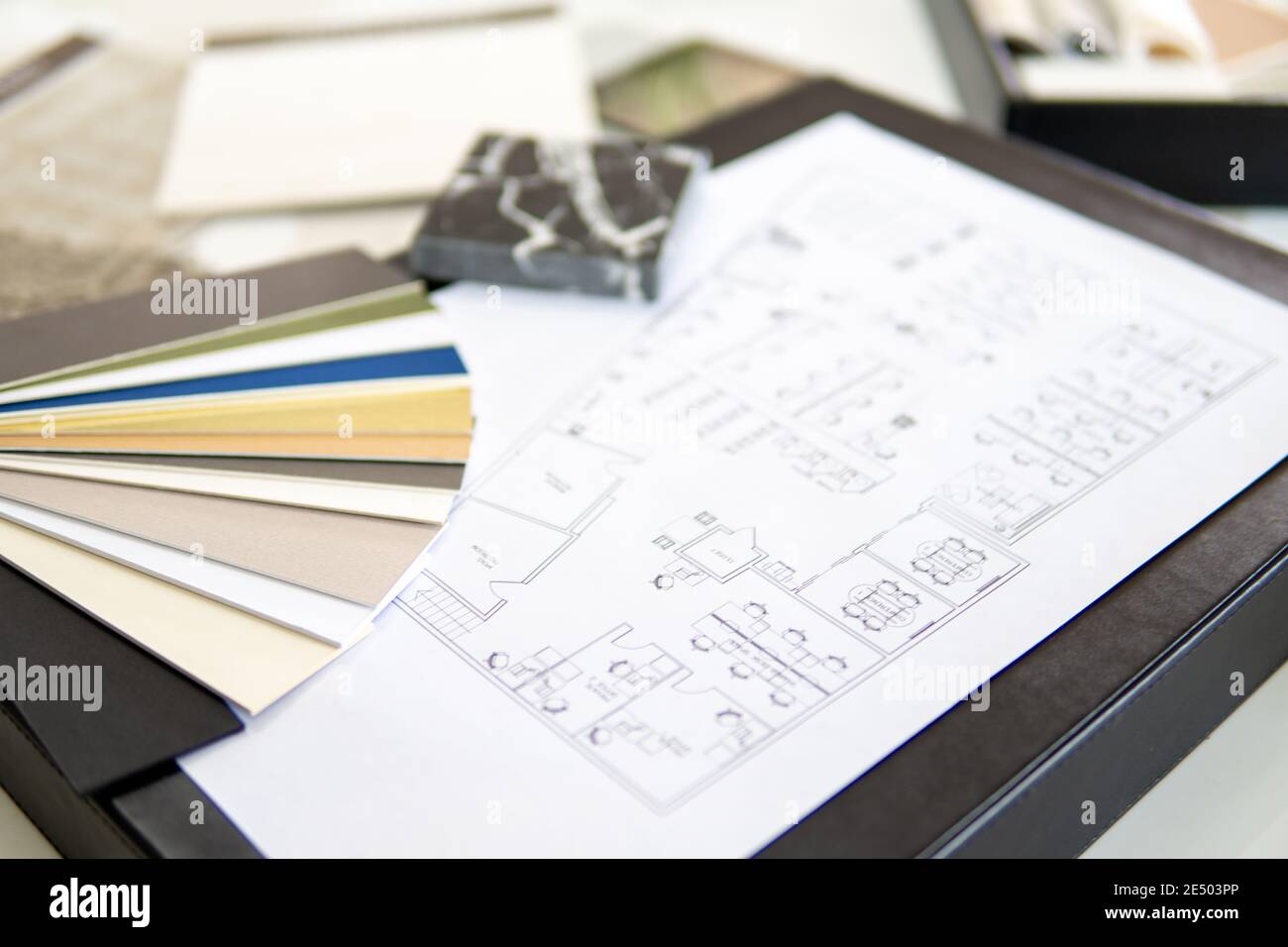 Interior designer's working table, an architectural plan of the house ...