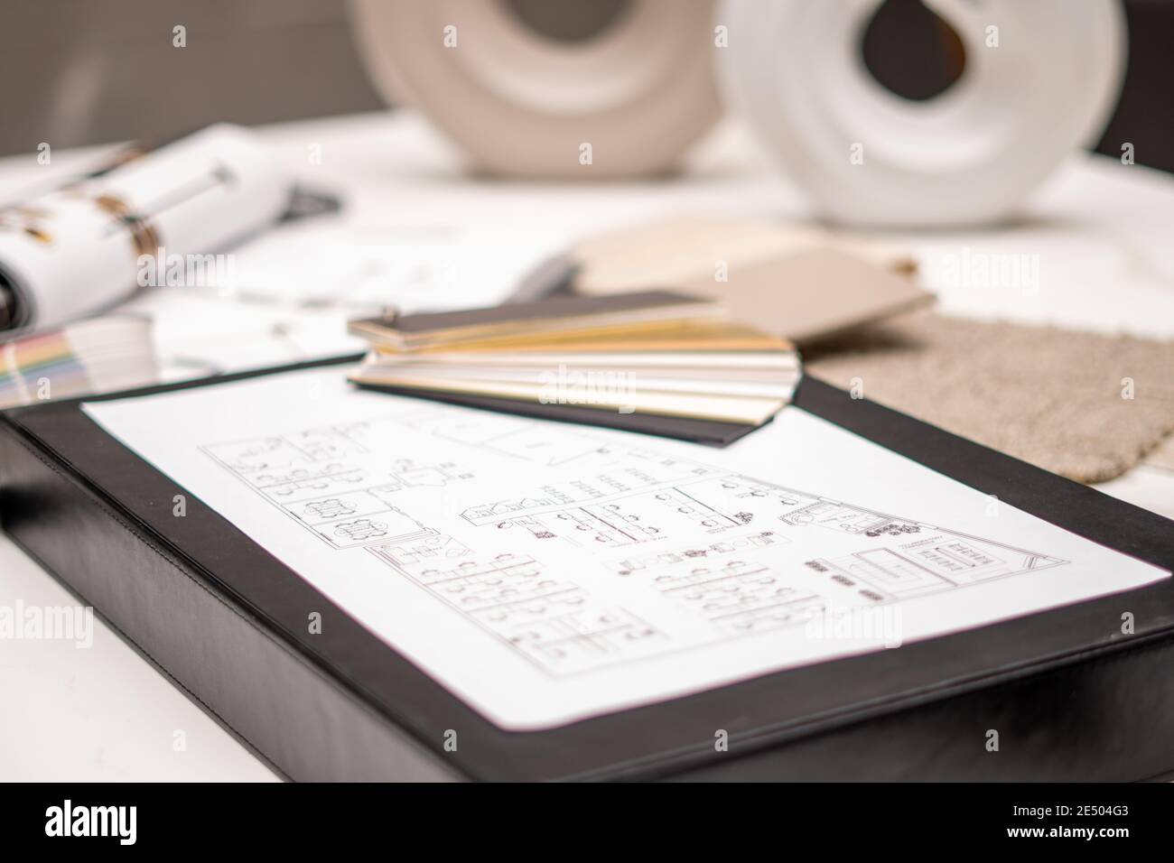 Interior designer's working table, an architectural plan of the house ...