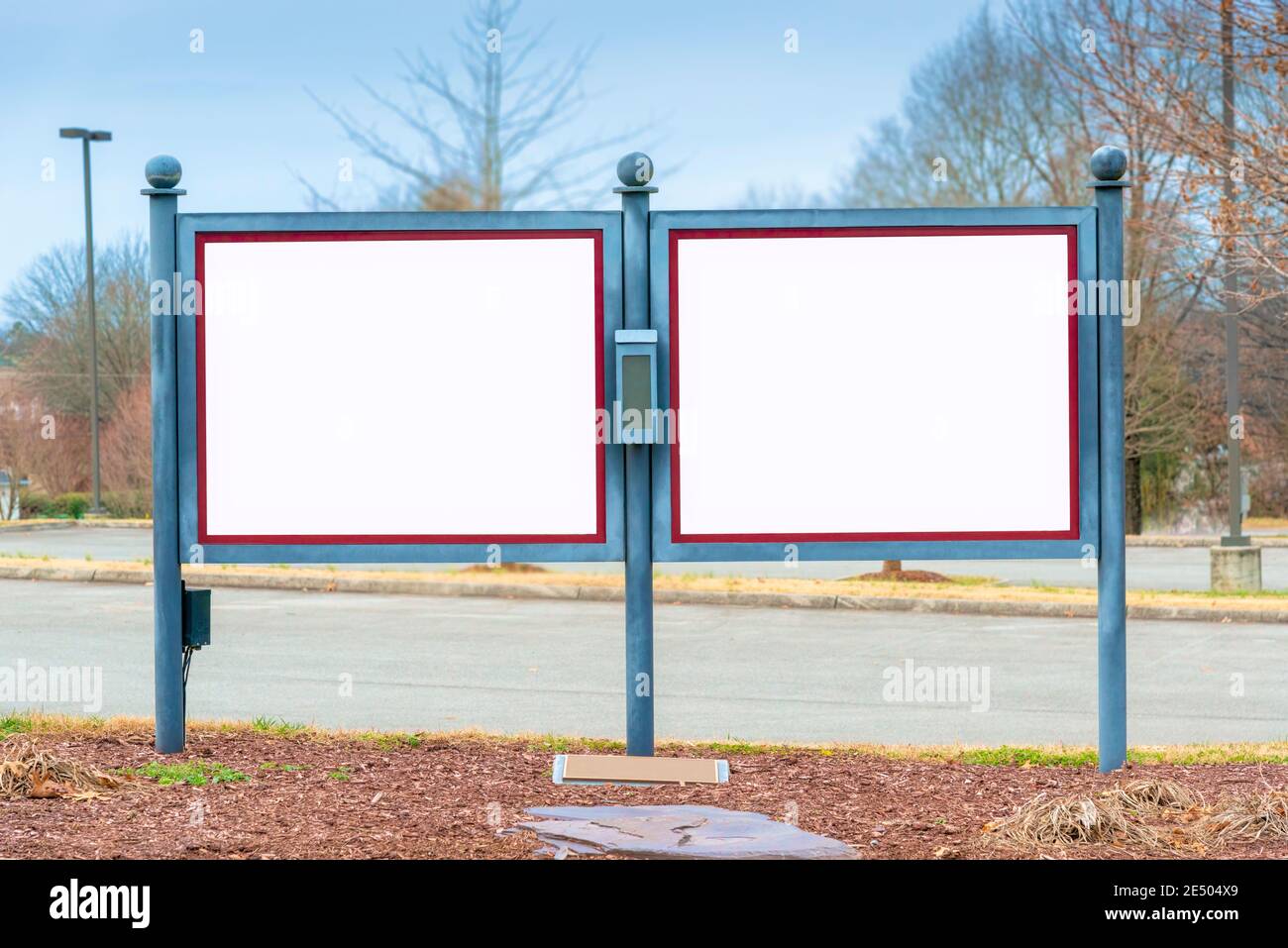 Horizontal shot of two blank twin outdoor signs or bulletin boards.  Lots of copy space. Stock Photo