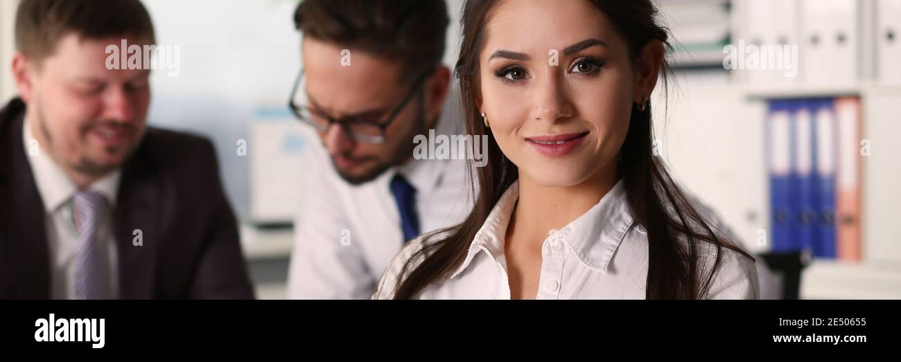 Pretty smiling lady posing in the office Stock Photo