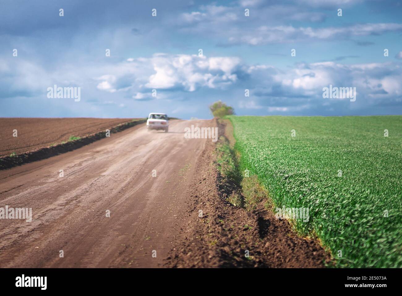Car on country road landscape and beautiful clouds Stock Photo