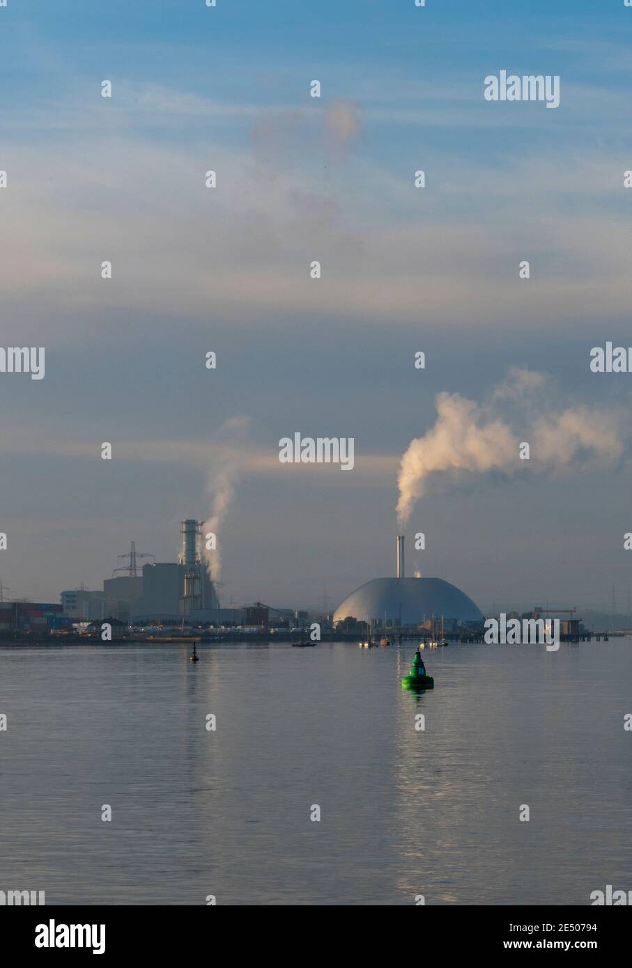 the environmental waste incinerator t marchwood in the port of southampton docks burning incinerating rubbish and producing green power and energy Stock Photo