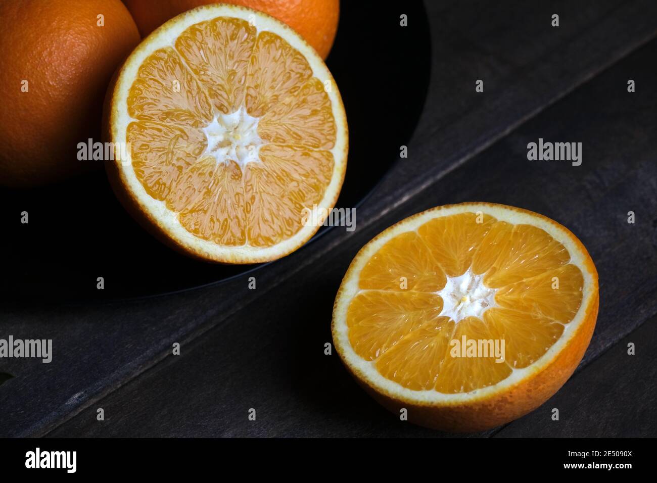 Orange cut in half with orange hi-res stock photography and images - Alamy