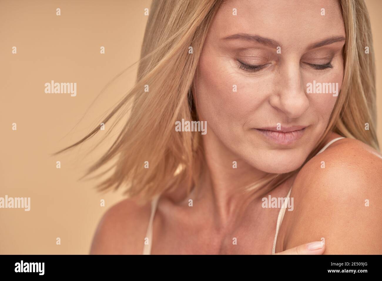 Beautiful mature woman posing in hi-res stock photography and images ...