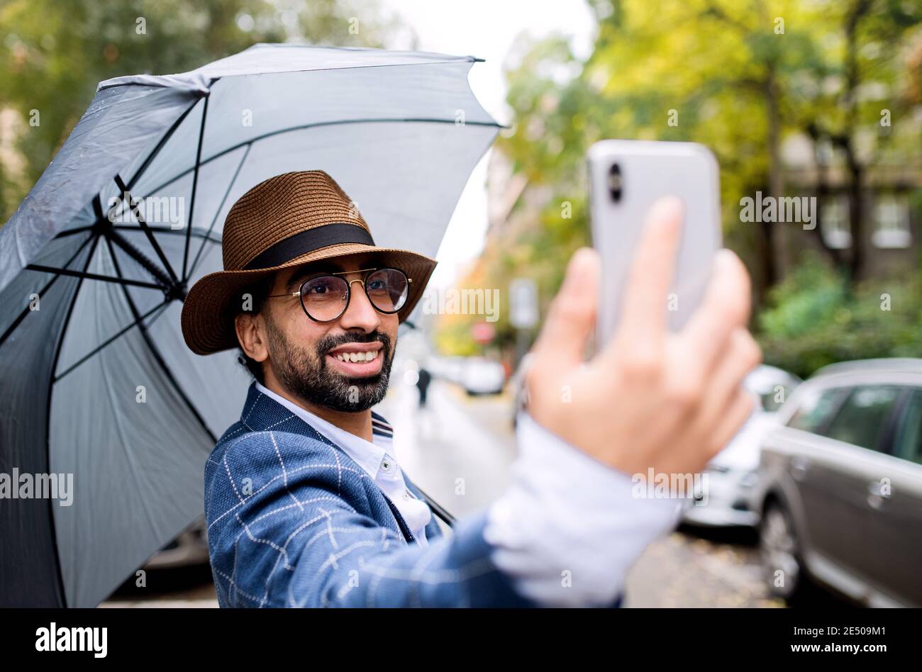 Im in town. Lets hook up. a handsome young man using his mobile phone while  out in the city Stock Photo - Alamy