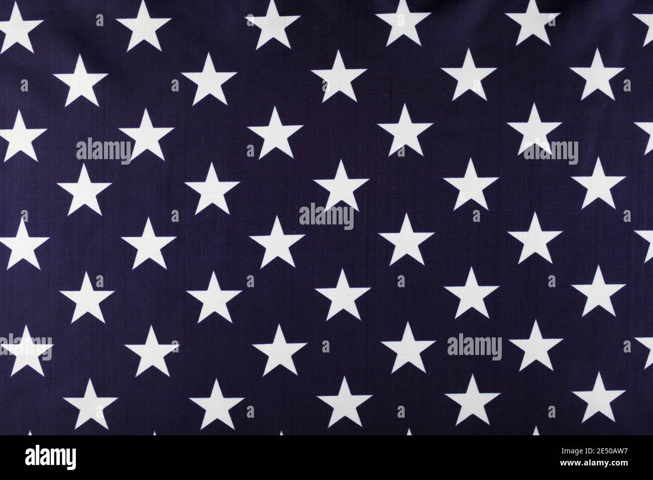 White stars on a blue background, USA flag closeup, background, top