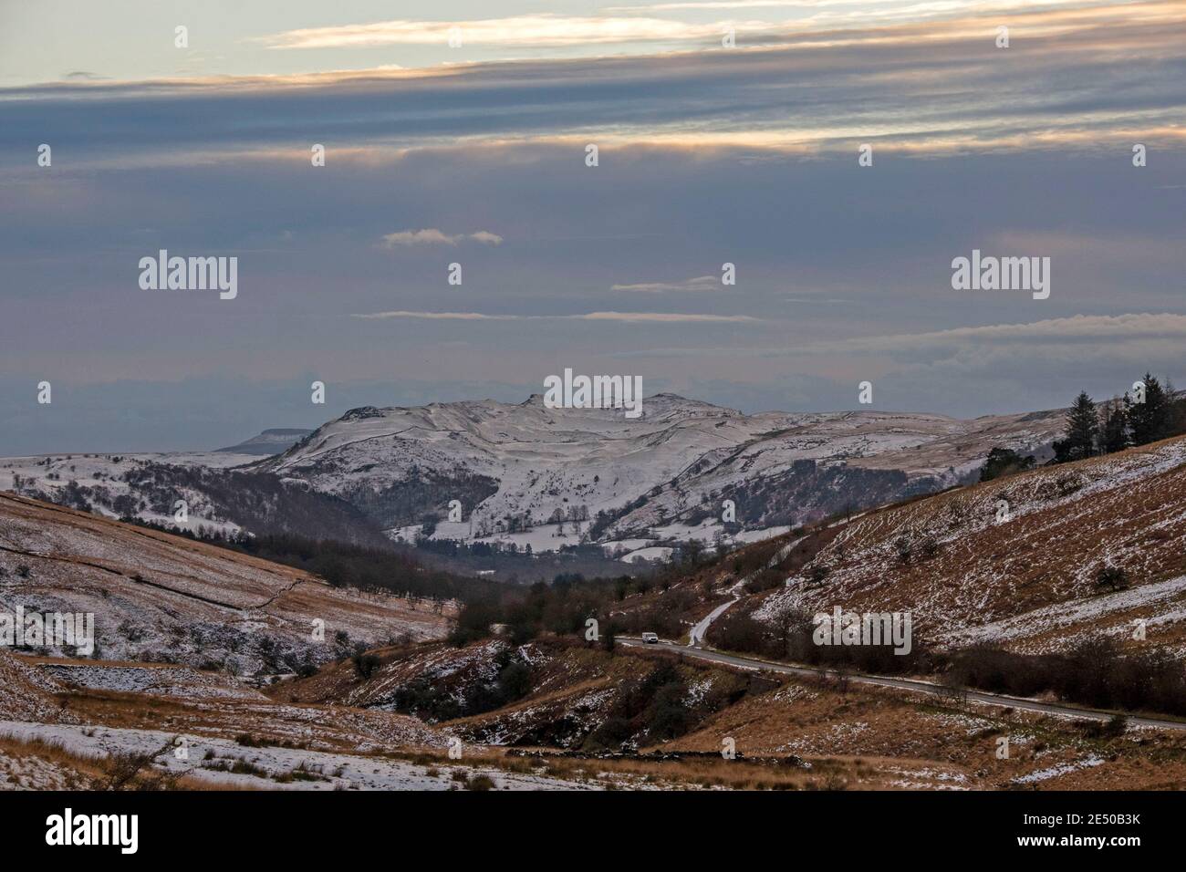 Ystradgynlais, UK. 25th Jan, 2021. A lone motorist drives up through the snowy mountains at Abercrave in the Brecon Beacons late this afternoon as the temperature starts to drop in the cold weather. Credit: Phil Rees/Alamy Live News Stock Photo