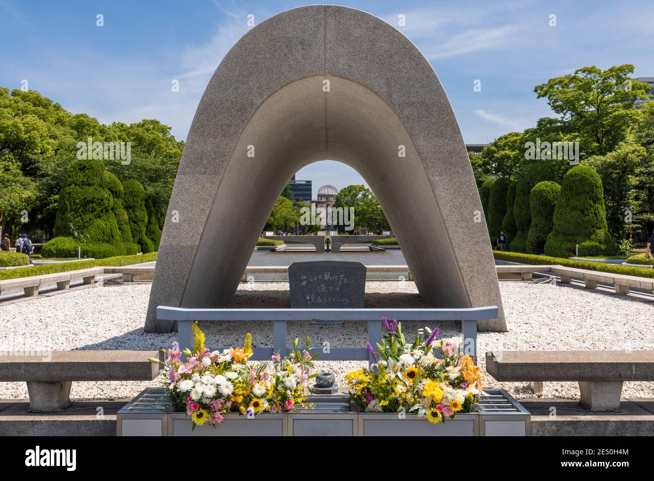 Symmetrical shot of the Hiroshima victims memorial cenotaph in a bright summer day Stock Photo